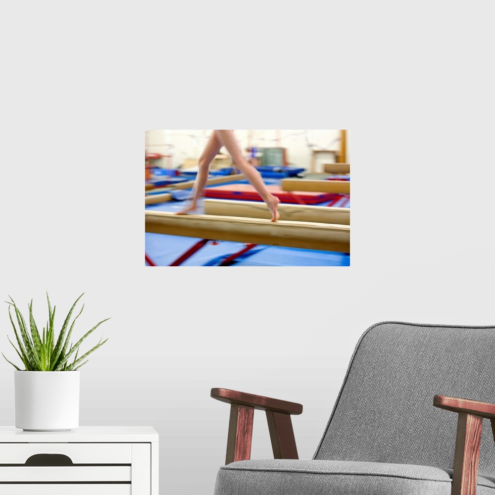 A modern room featuring Girl (16-17) running on balance beam, low section (blurred motion)