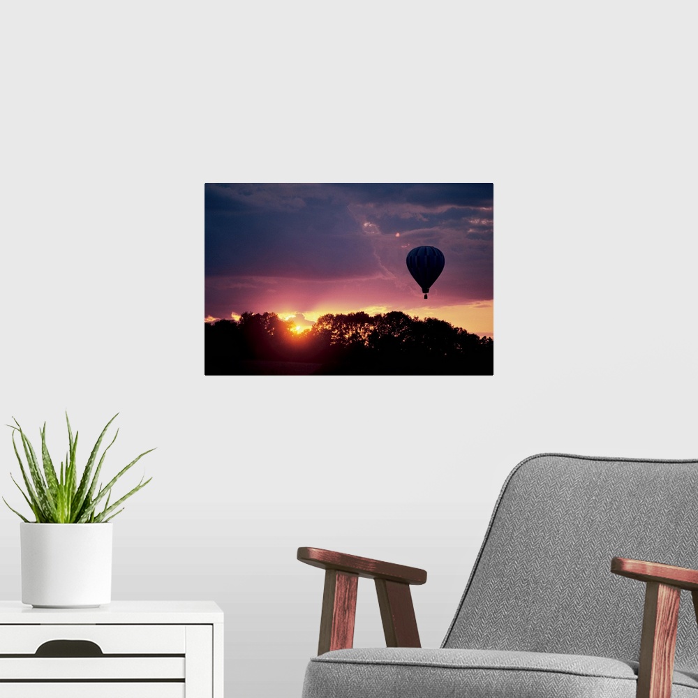 A modern room featuring Hot air balloon at sunset