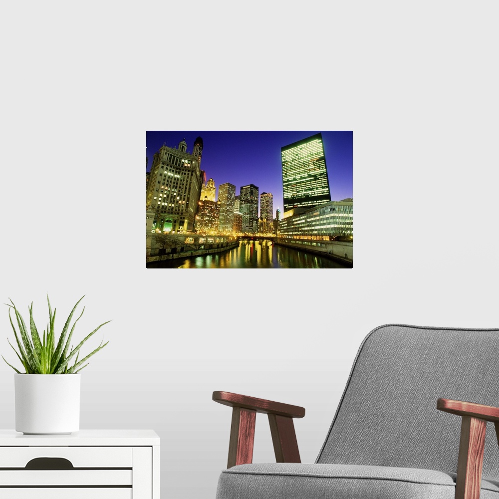 A modern room featuring USA, Illinois, Chicago, skyscrapers along River Chicago, dusk