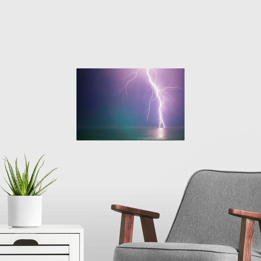 A modern room featuring Lightning Storm Over Ocean