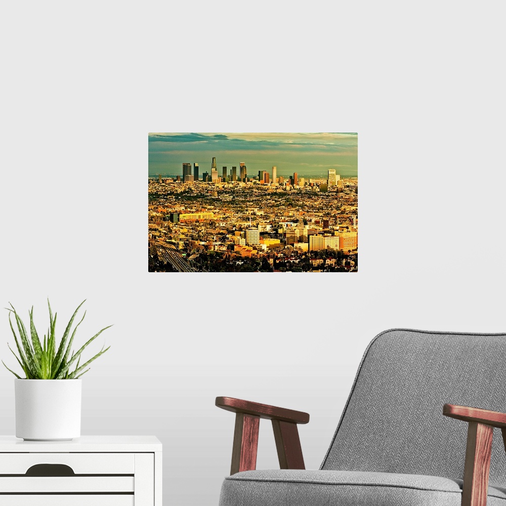 A modern room featuring Los Angeles from above with Hollywood in foreground and LA skyline in distance.