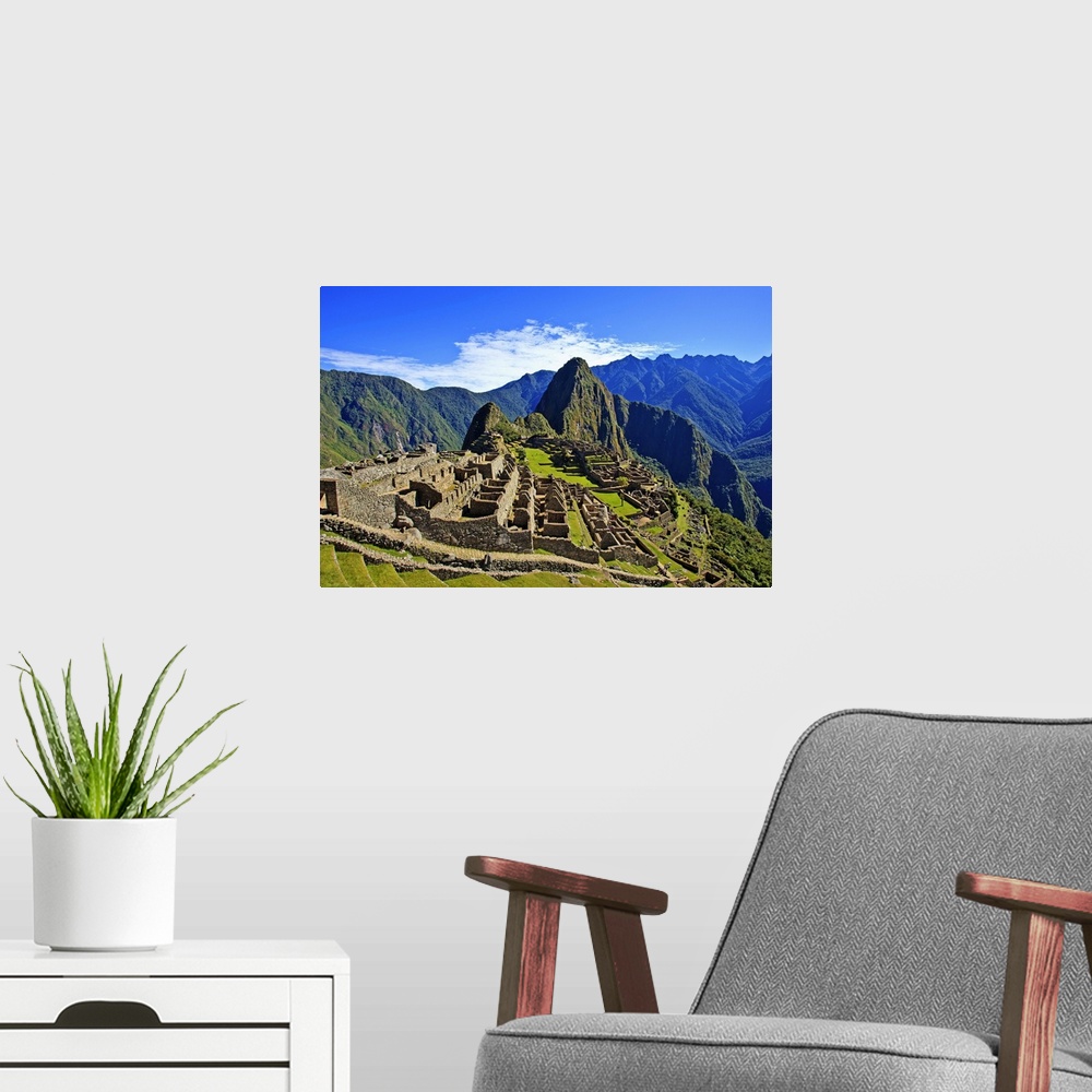 A modern room featuring Machu Picchu is a 15th century Inca site located 2,430 metres above sea level on a mountain ridge...
