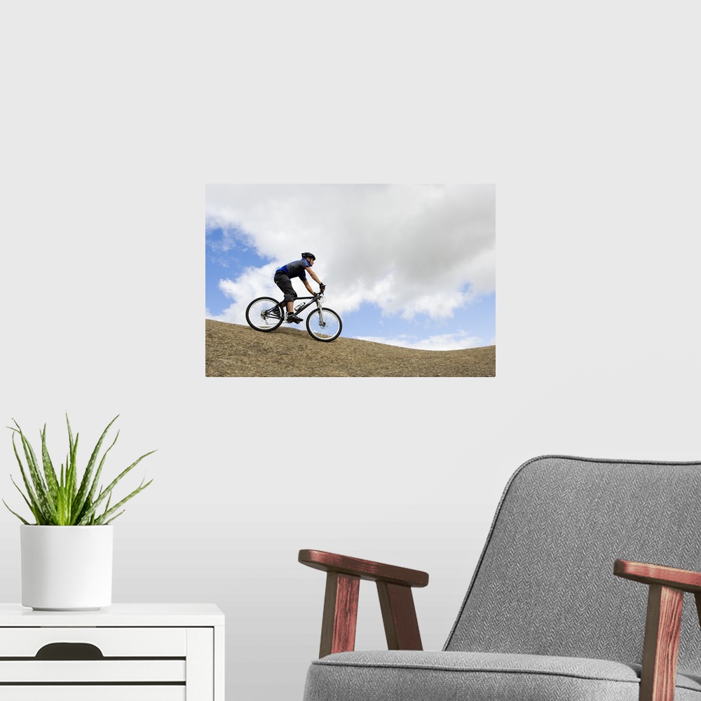 A modern room featuring Man riding mountain bike
