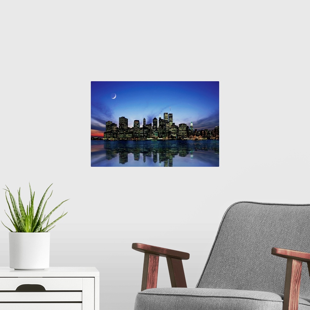 A modern room featuring Manhattan skyline at night, reflecting in river