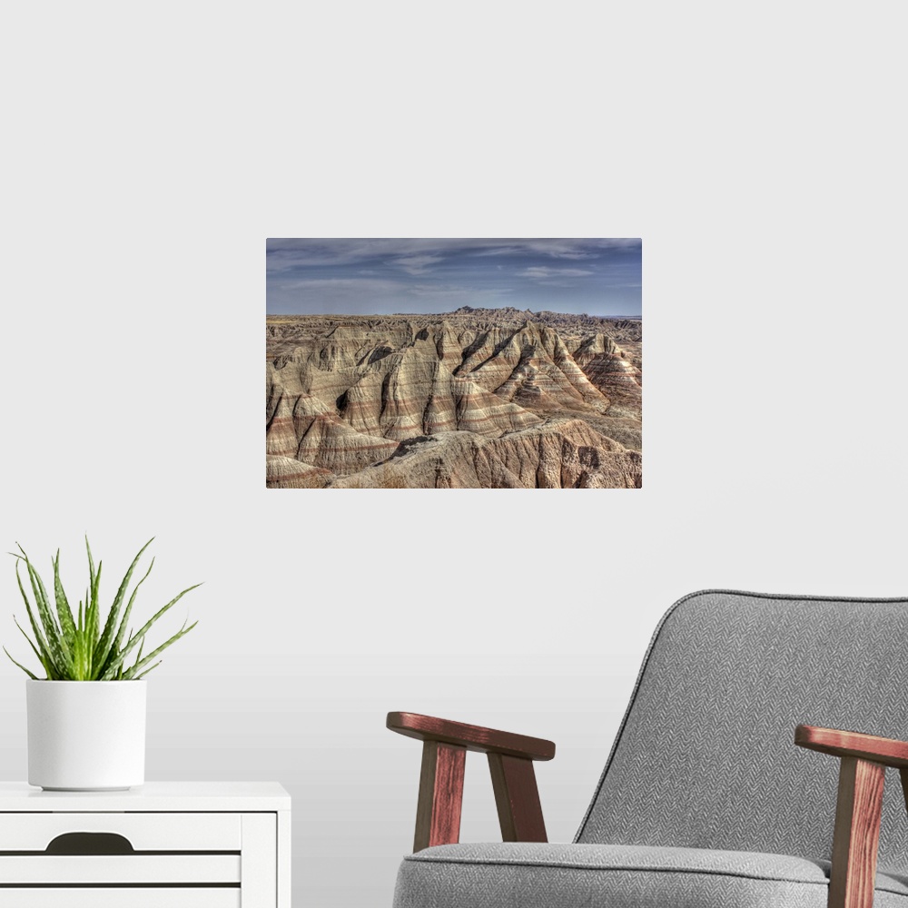 A modern room featuring Natural formations in Badlands of South Dakota, showing striations and contours.Hills show erosio...