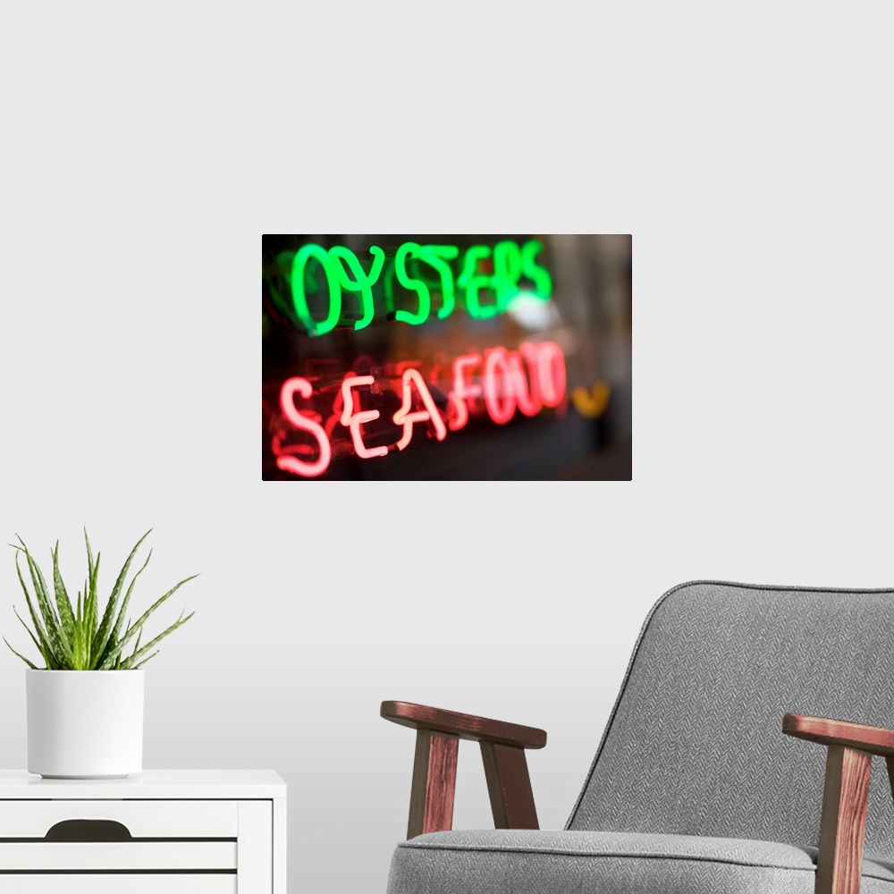 A modern room featuring Neon oysters and seafood sign