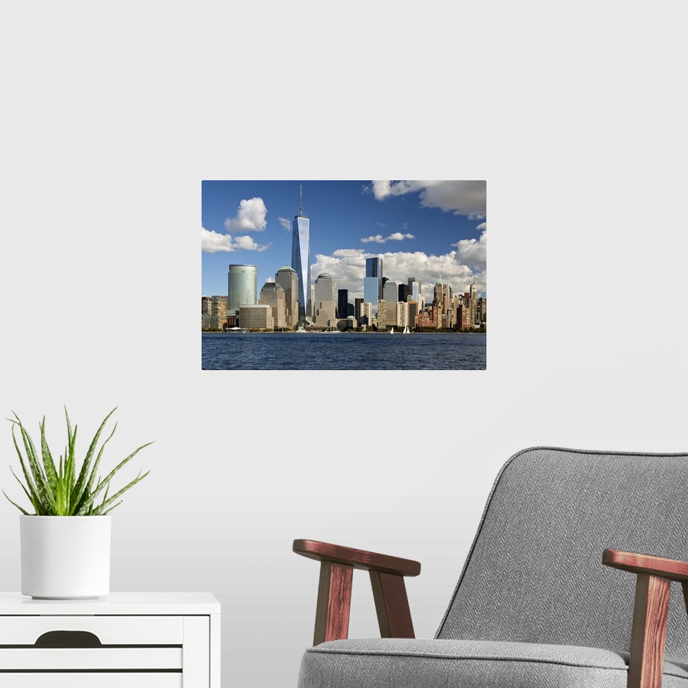 A modern room featuring The Financial District viewed over the Hudson River towards Manhattan
