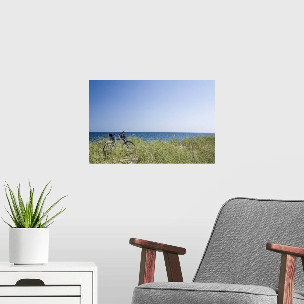 A modern room featuring Ocean and horizon with clear blue sky in background.