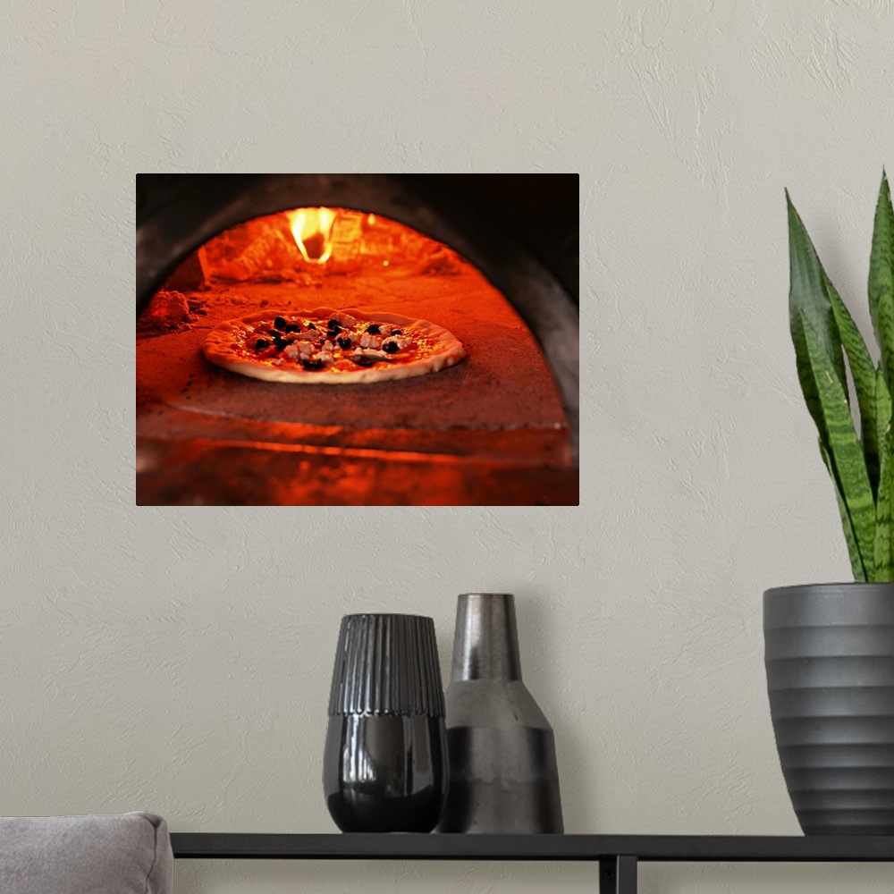 A modern room featuring Pizza baking in the forno