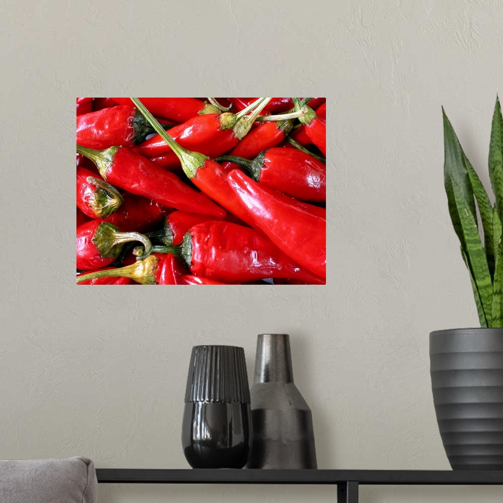 A modern room featuring A batch of chili peppers are photographed very closely.