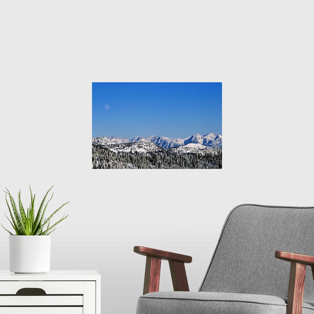 A modern room featuring Rocky Mountains & spine of Continental Divide in Glacier National Park, MT during winter seen fro...