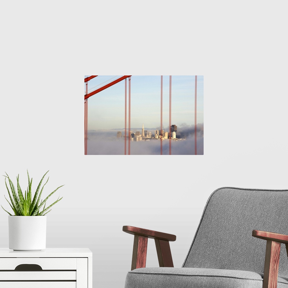 A modern room featuring San Francisco in fog through Golden Gate Bridge.