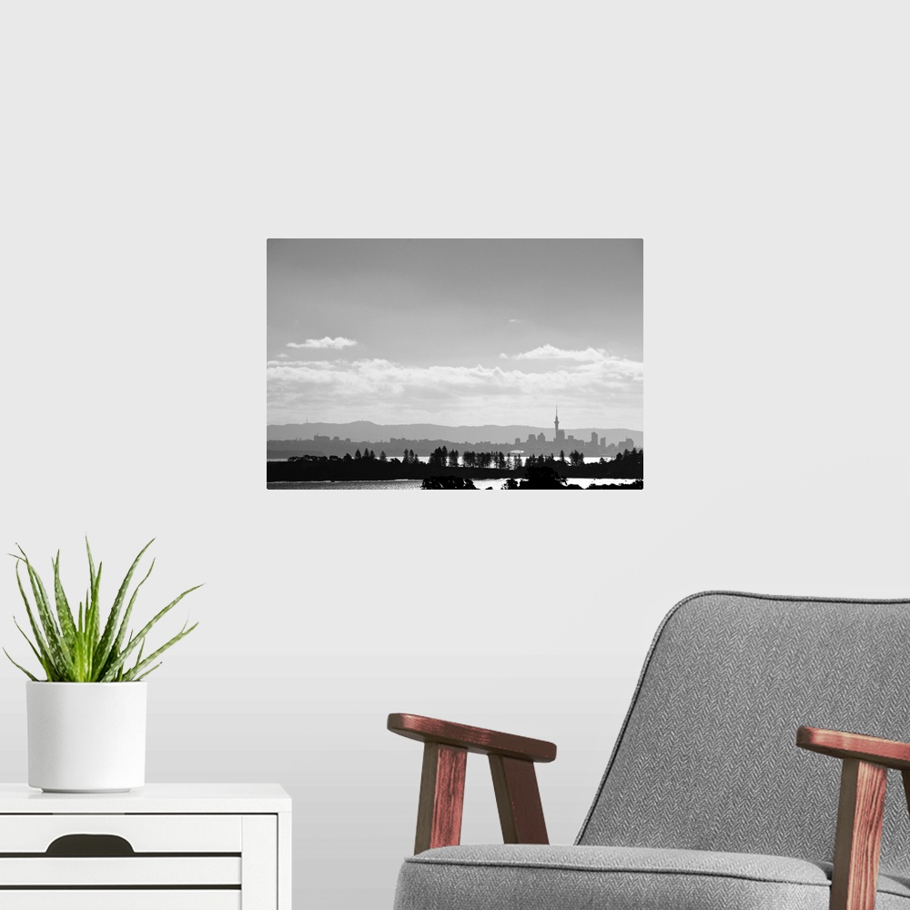 A modern room featuring Black and white skyline of Auckland, New Zealand as seen from Waiheke Island, New Zealand.