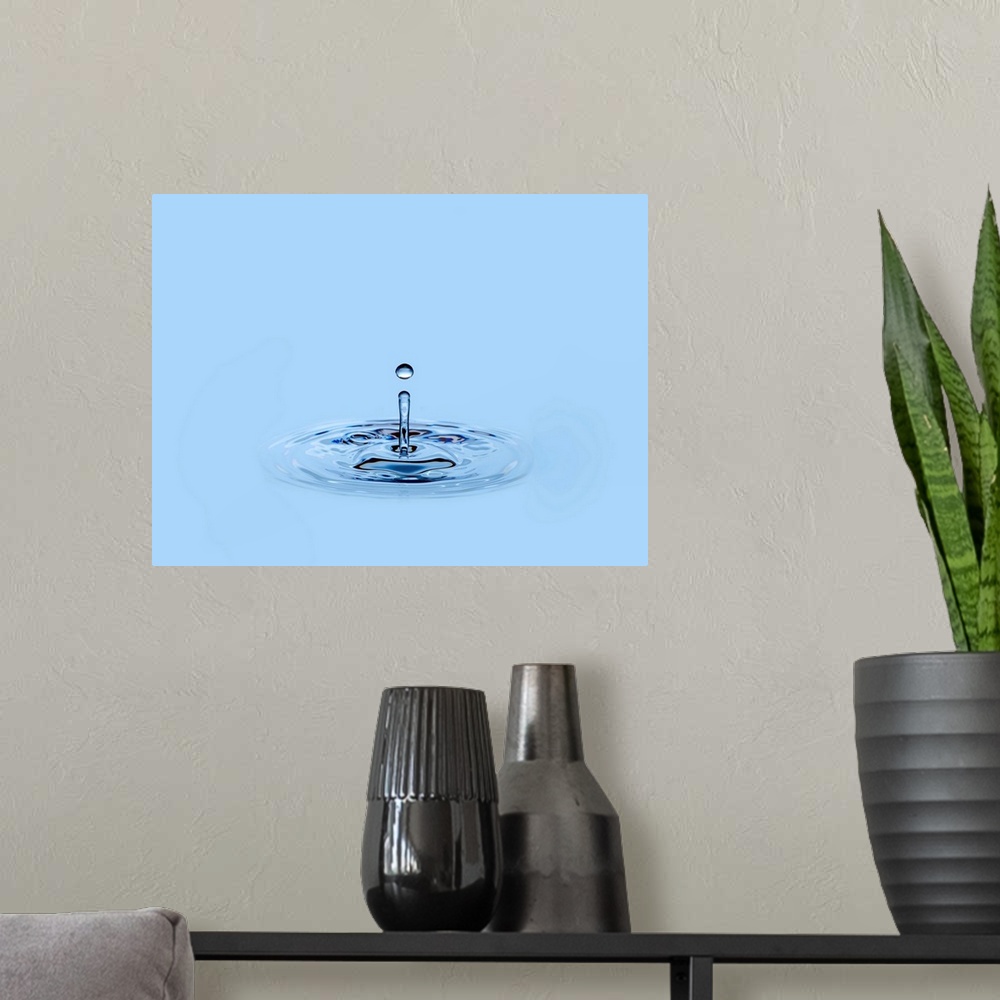 A modern room featuring Splashing waterdrop (droplet) falling into water