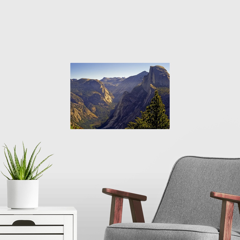A modern room featuring View of Tenaya Canyon in middle and Half Dome to right at Yosemite national park, California.