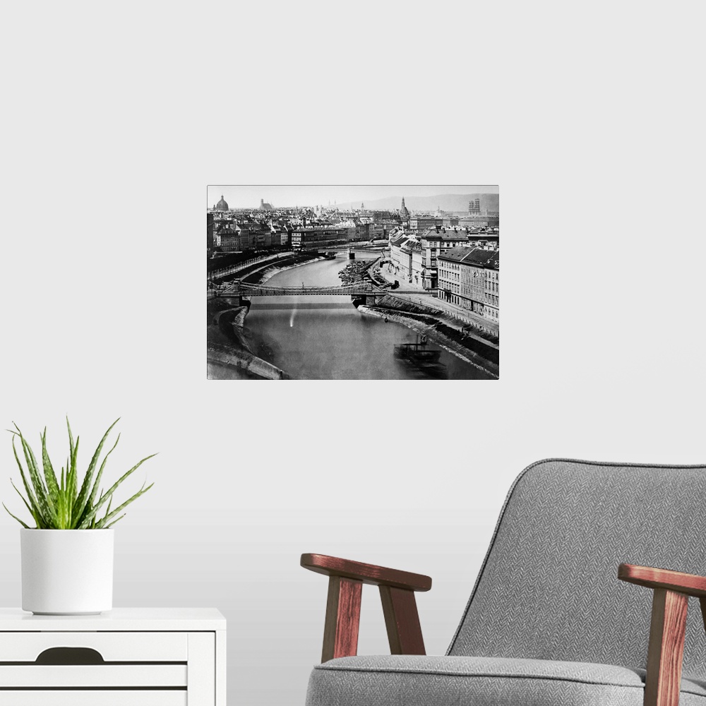 A modern room featuring A view of the Danube Canal as it passes through the city of Vienna.