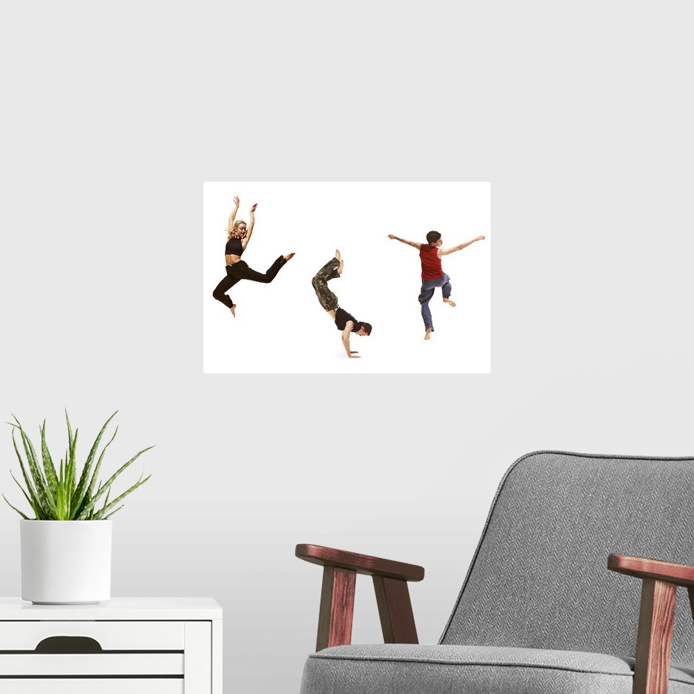 A modern room featuring three young dancers performing