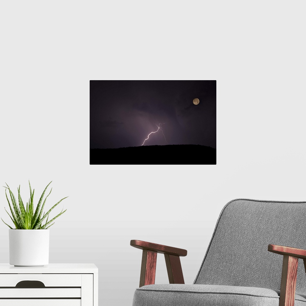 A modern room featuring Thunderstorm, thunderbolt lightning, flash over mountain and moon at night.
