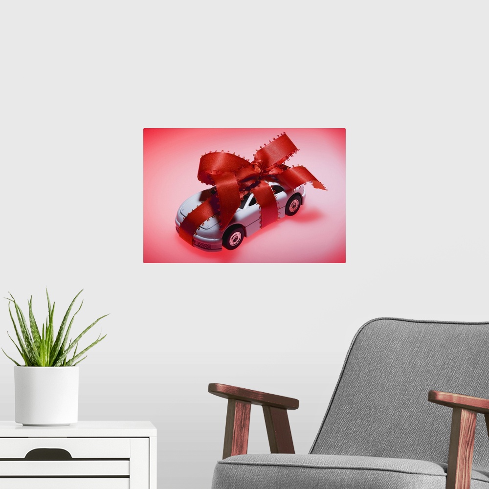 A modern room featuring Toy car wrapped in ribbon