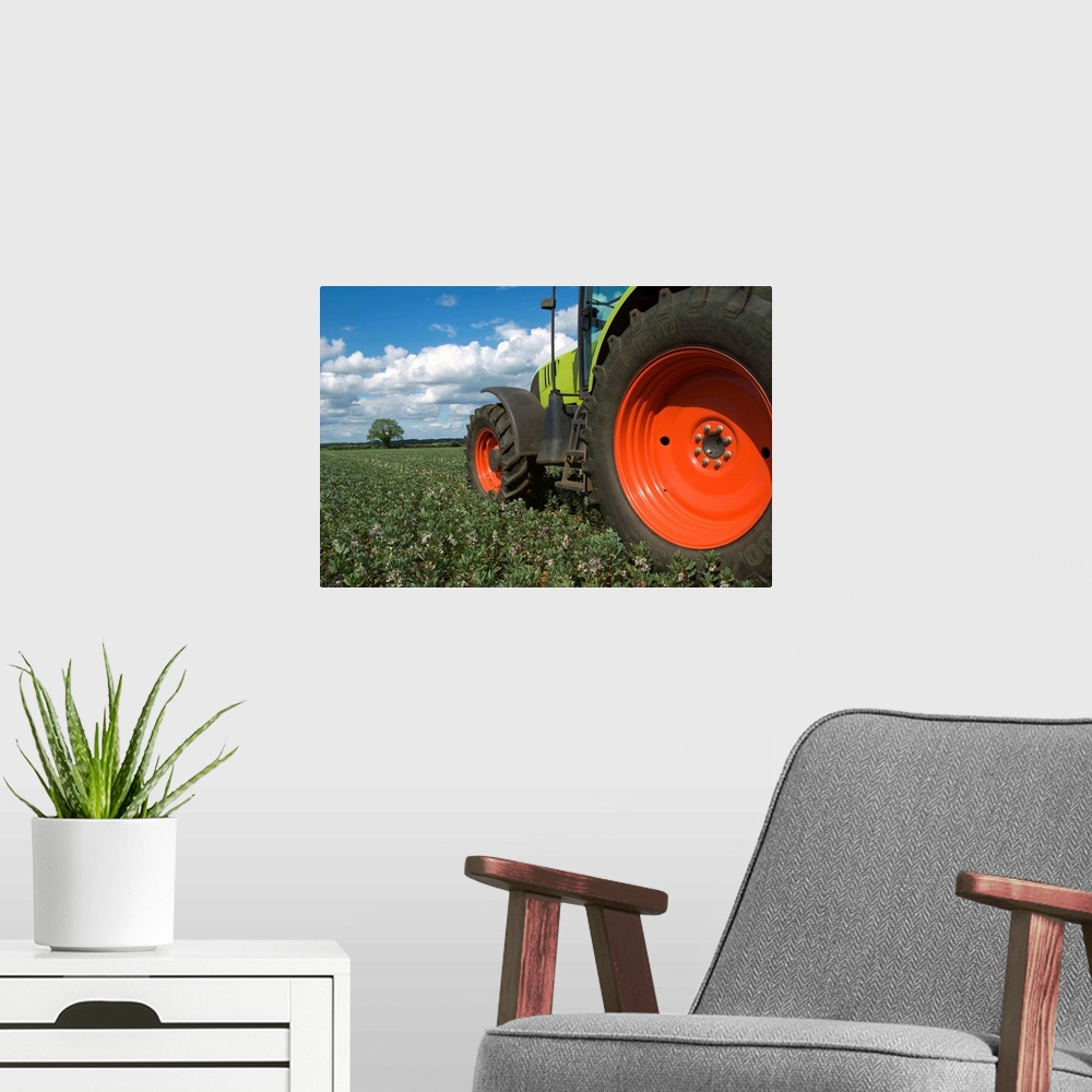 A modern room featuring Tractor driving through crops