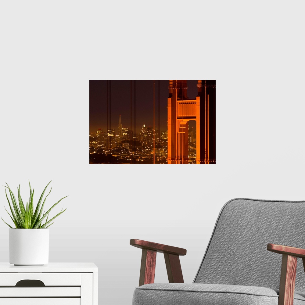 A modern room featuring Part of the Golden Gate Bridge and the San Francisco skyline are photographed during the evening ...