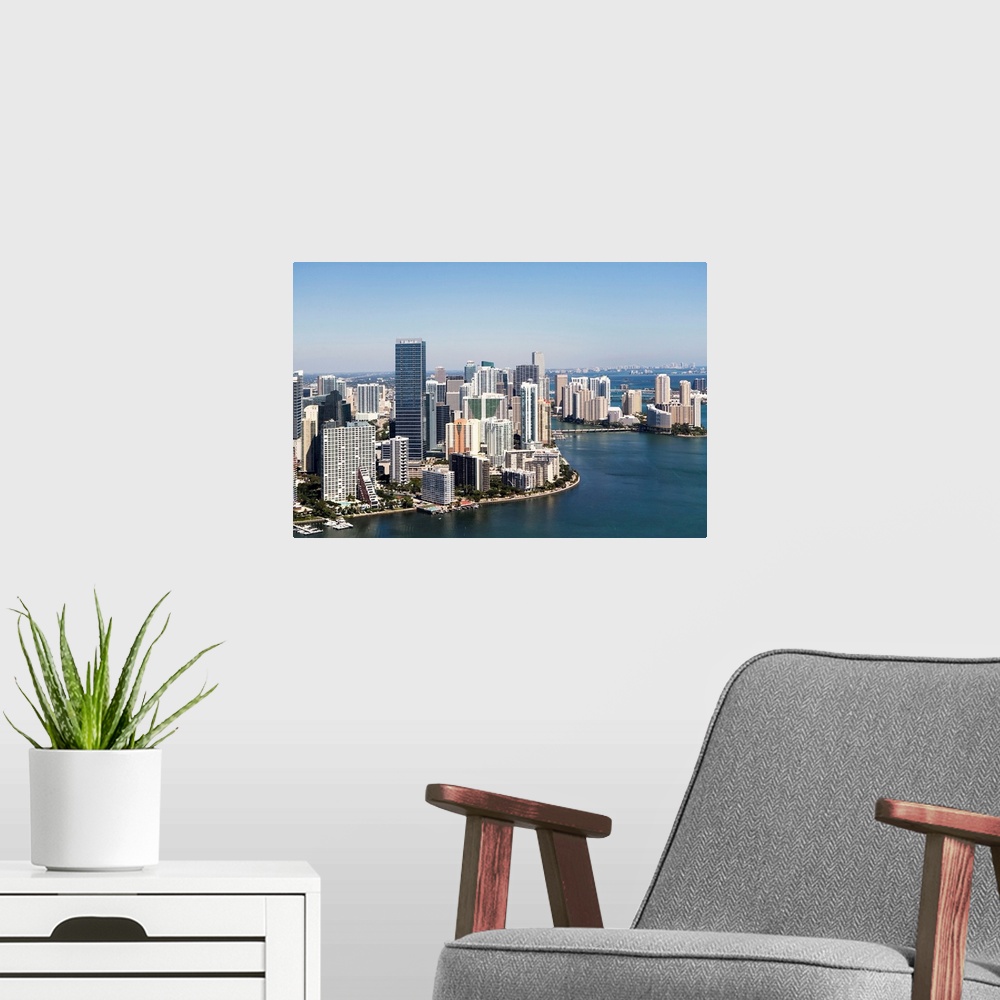 A modern room featuring USA, Florida, Miami skyline as seen from air