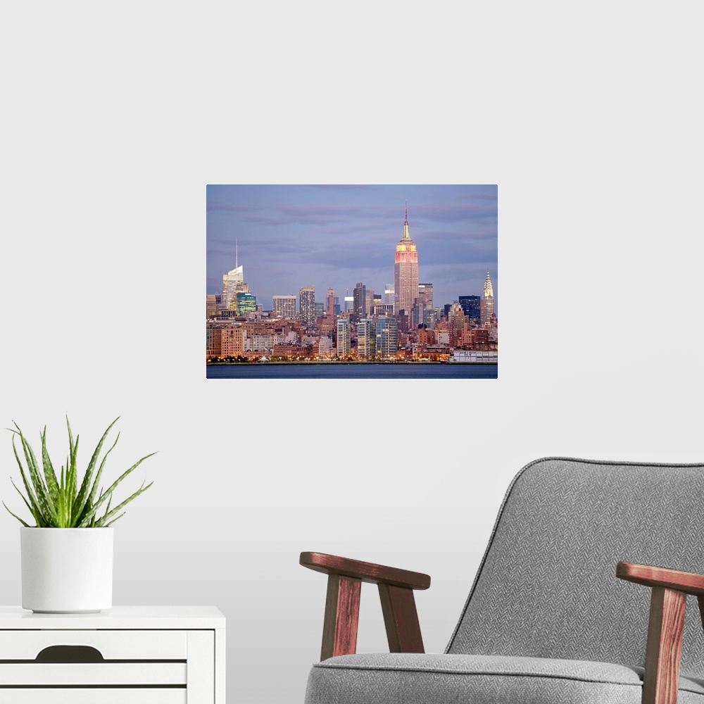 A modern room featuring USA, New York State, New York City, Skyline at dusk