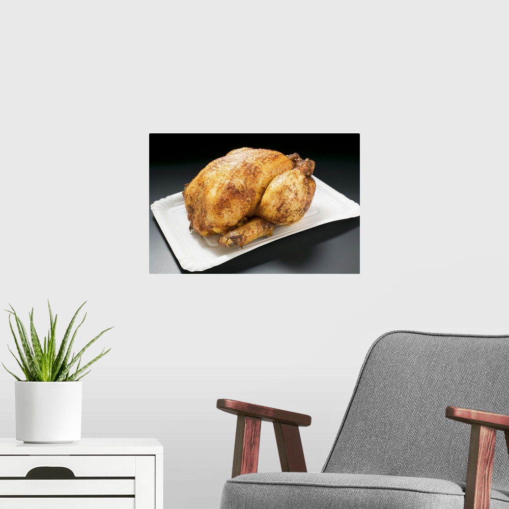 A modern room featuring Whole roast chicken on paper plate