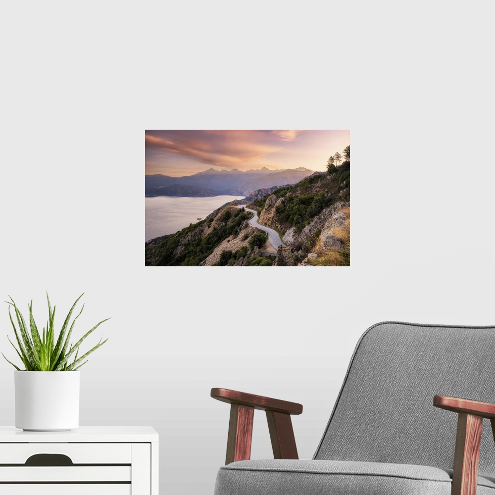 A modern room featuring The D824 road winding its way along the coast from Capu Rossu towards Piana on the west coast of ...