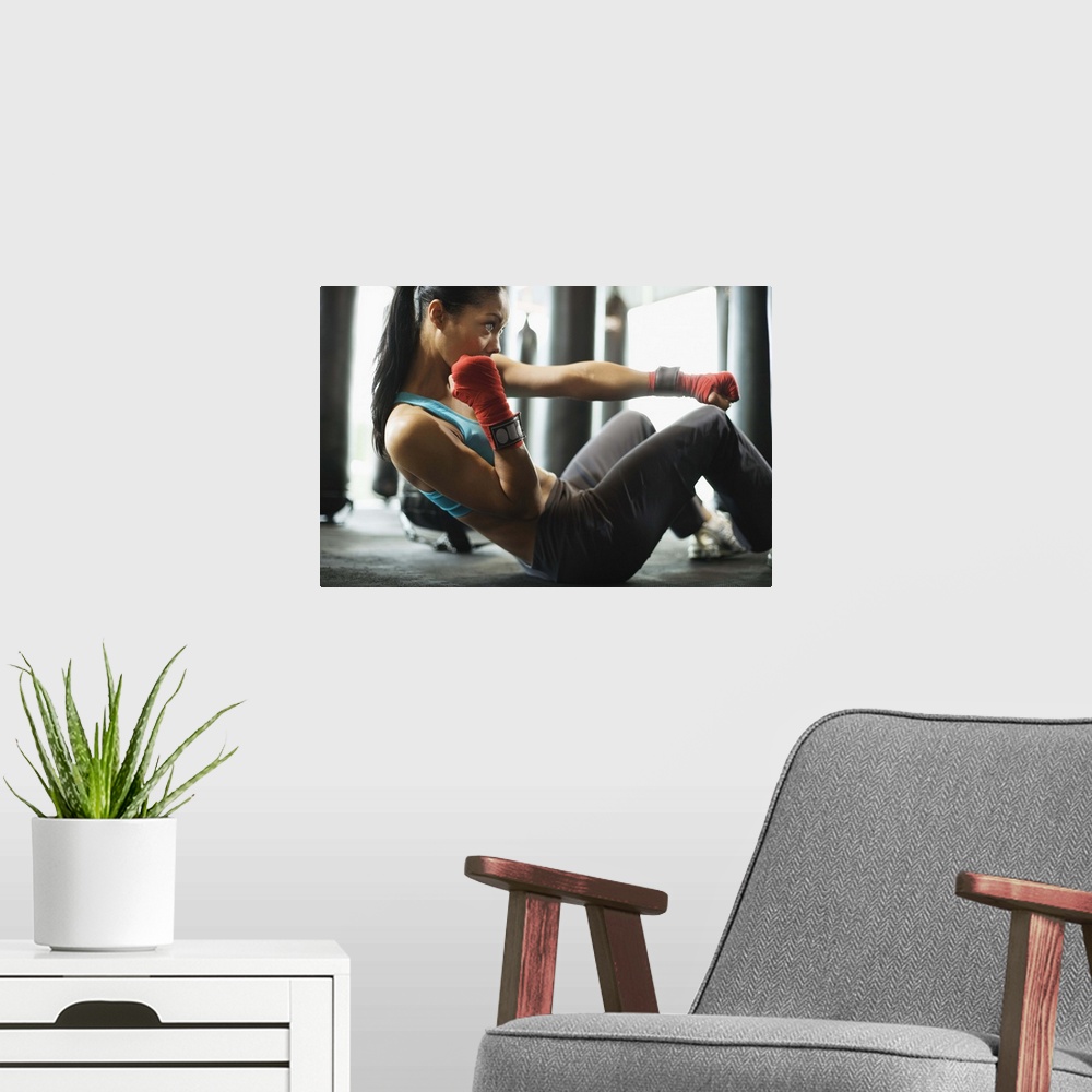 A modern room featuring Woman doing crunches in gym