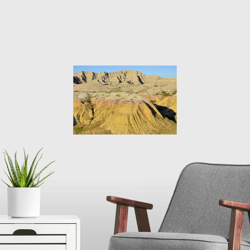 A modern room featuring The Yellow Mounds, part of the Badlands National Park in South Dakota.