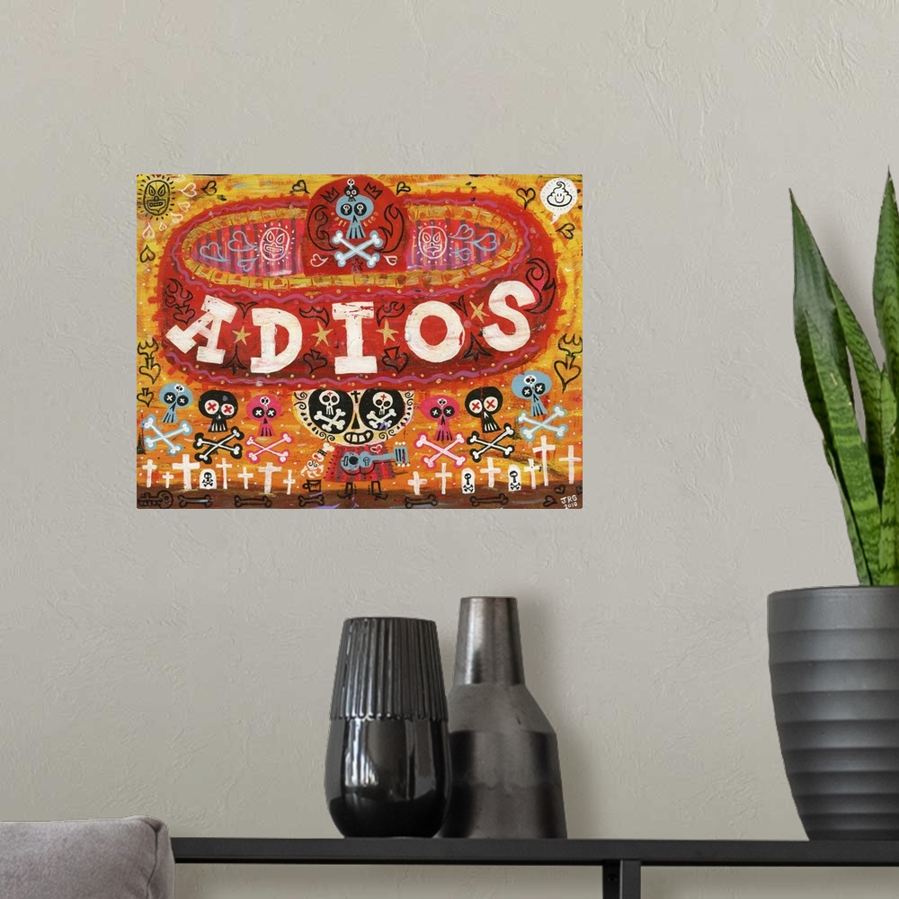 A modern room featuring Latin art of a calavera wearing a large red sombrero with the word "Adios."