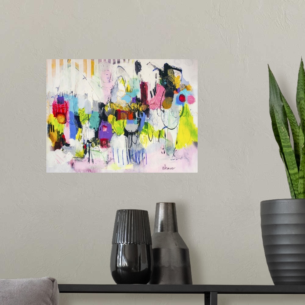 A modern room featuring Contemporary abstract painting using bright vibrant neon splashes of color against a soft pink an...