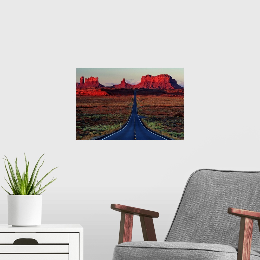A modern room featuring Photograph of a road dividing the Arizona and Utah deserts.