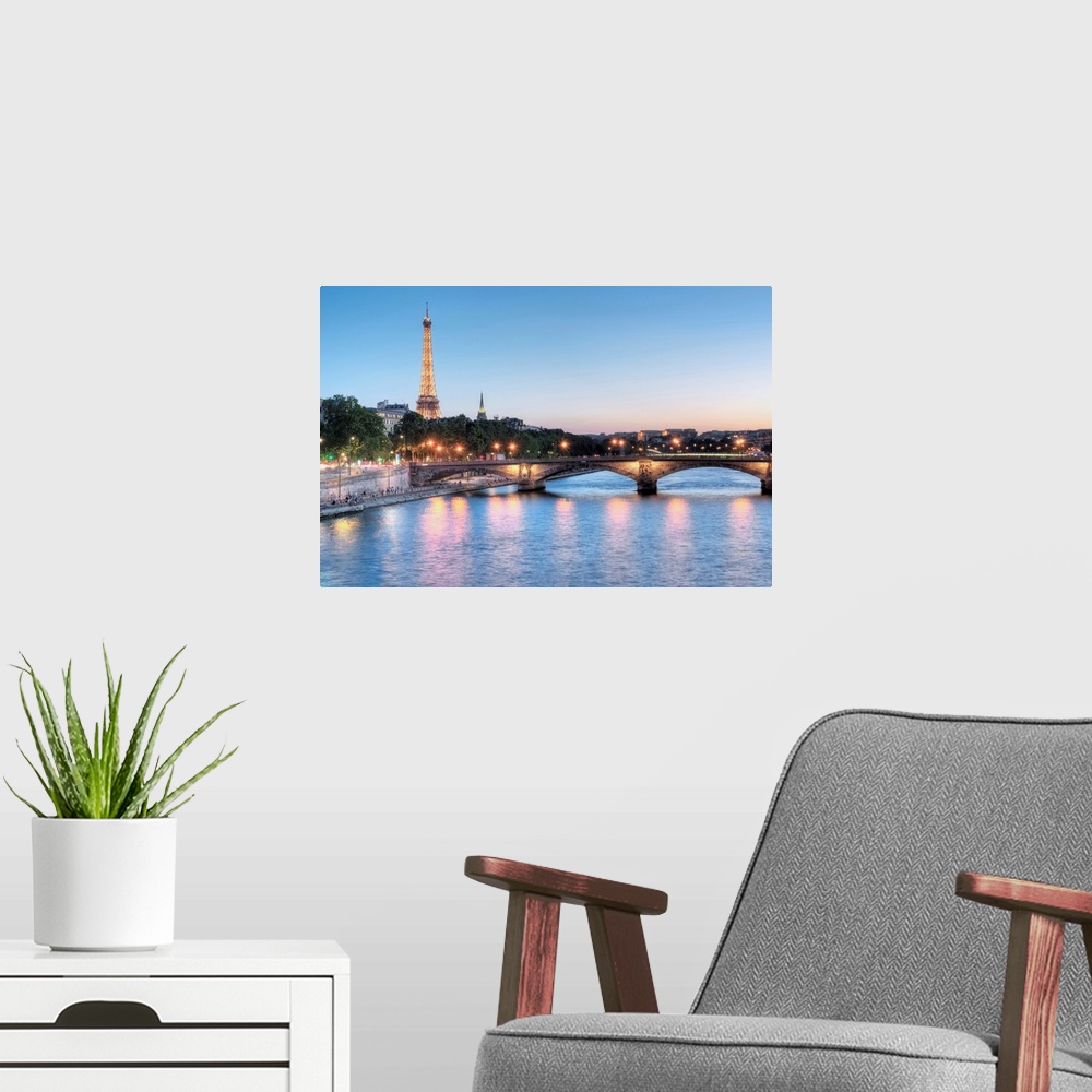 A modern room featuring A photograph of the Seine river in Paris with the Eiffel Tower in the background.