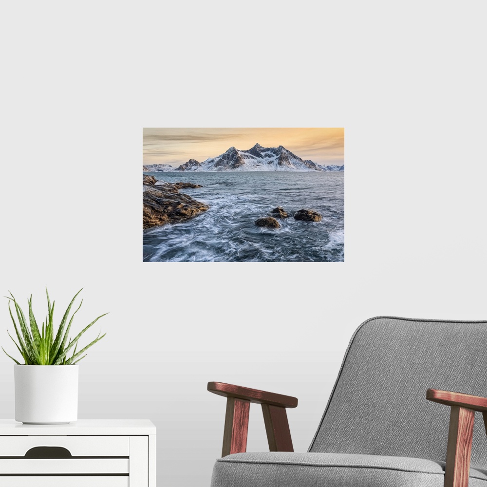 A modern room featuring A magical winter sunset around Flakstad beach, Lofoten Islands, Northern Norway