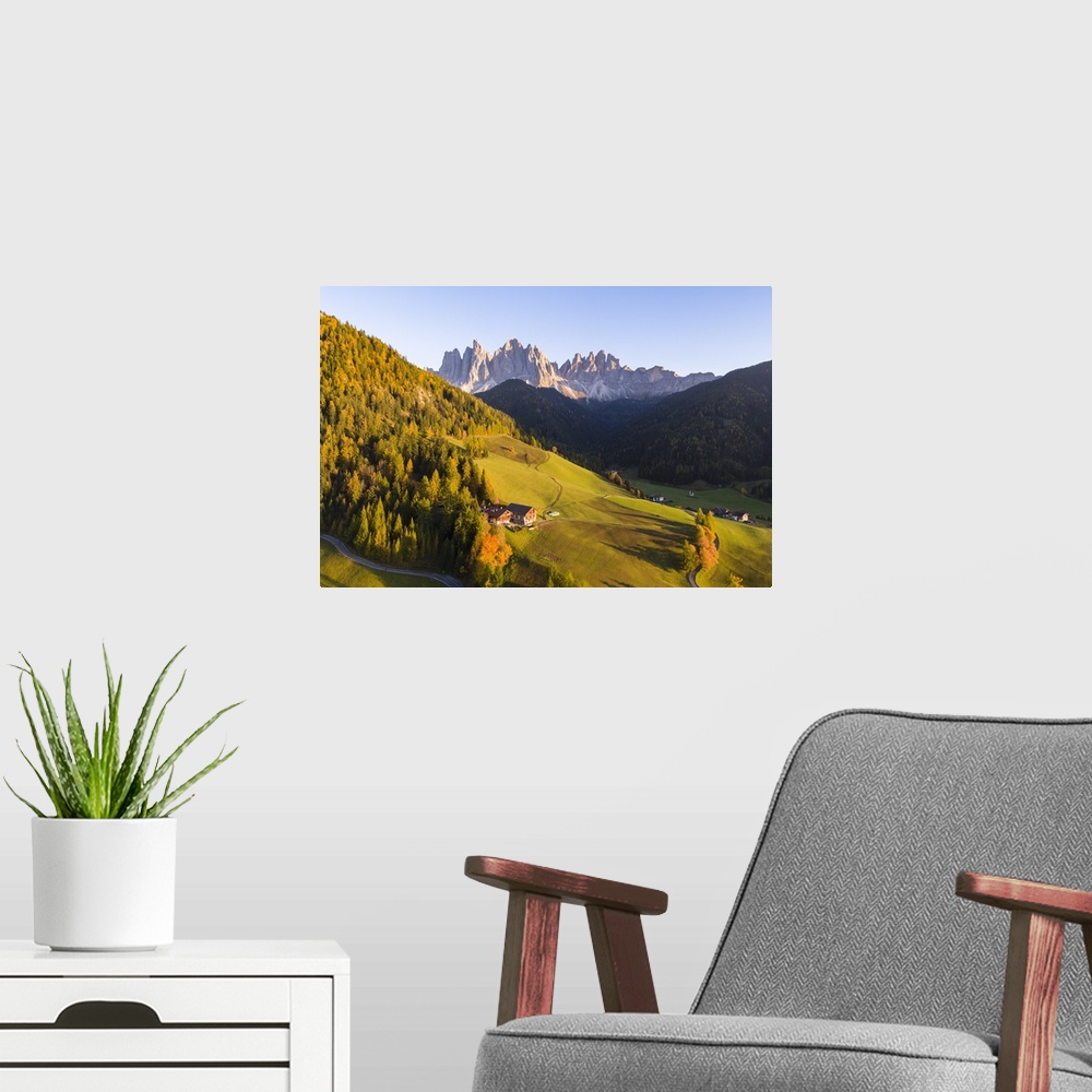 A modern room featuring Aerial view of Funes valley at sunset, Dolomites, Italy
