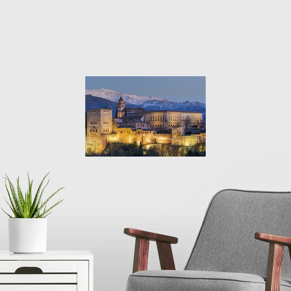 A modern room featuring View at dusk of Alhambra palace with the snowy Sierra Nevada in the background, Granada, Andalusi...