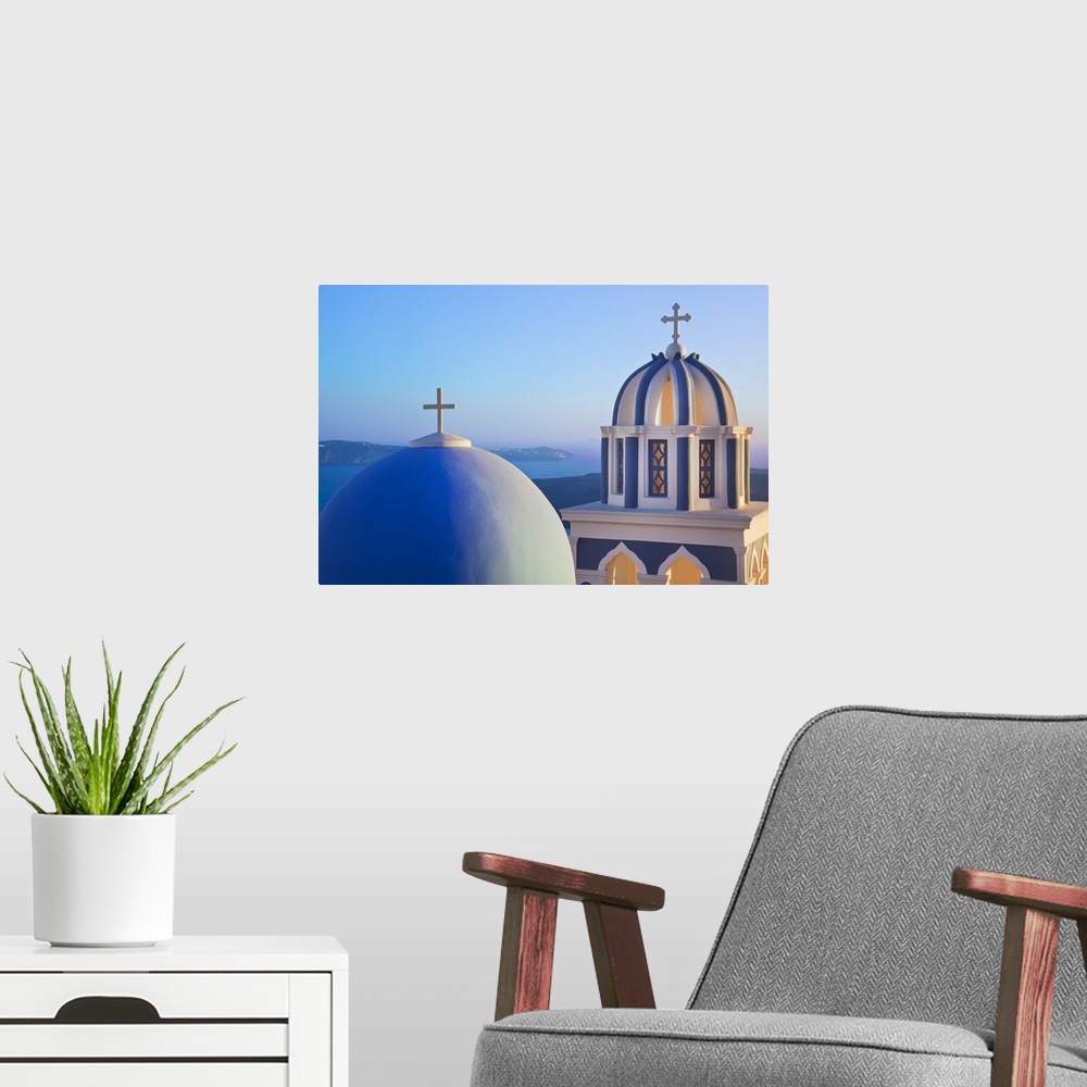 A modern room featuring Bell Towers of Orthodox Church overlooking the Caldera in Fira, Santorini (Thira), Cyclades Islan...