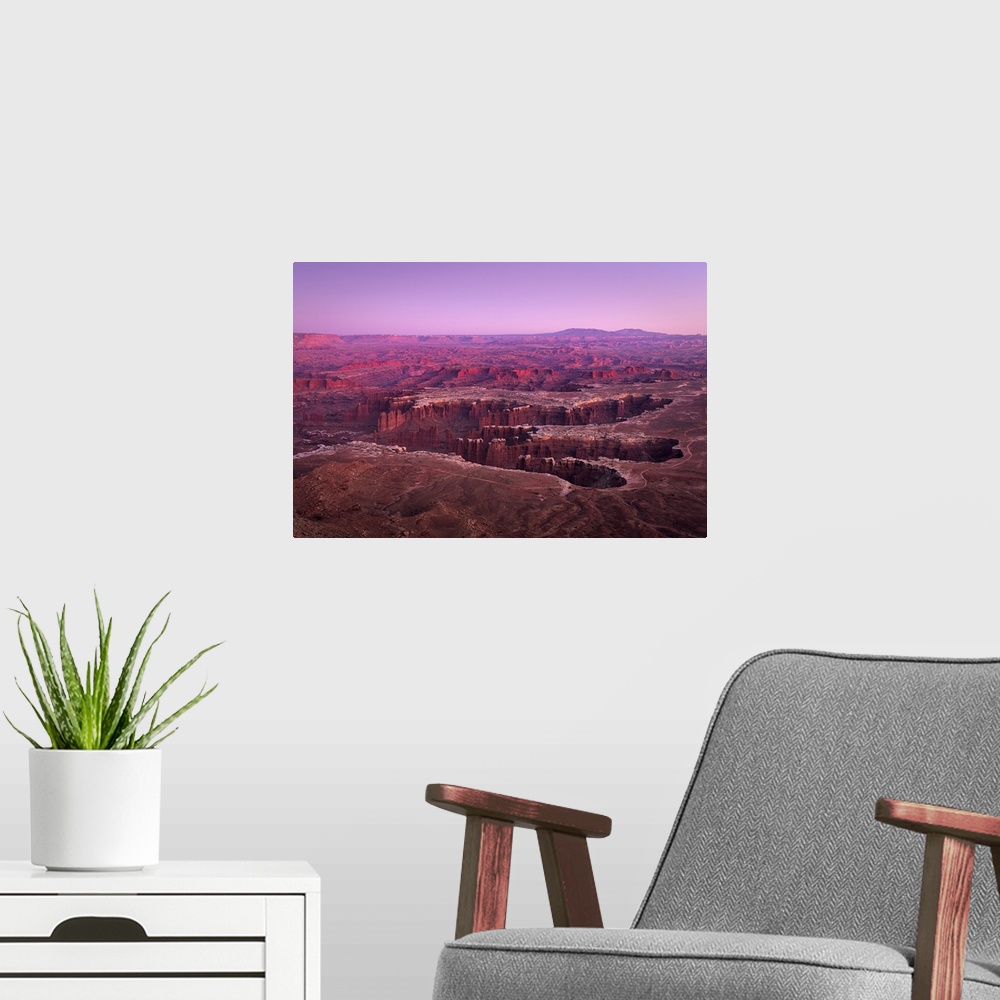 A modern room featuring Dramatic canyon terrain at Grand View Point at sunset, Canyonlands National Park, Utah, USA