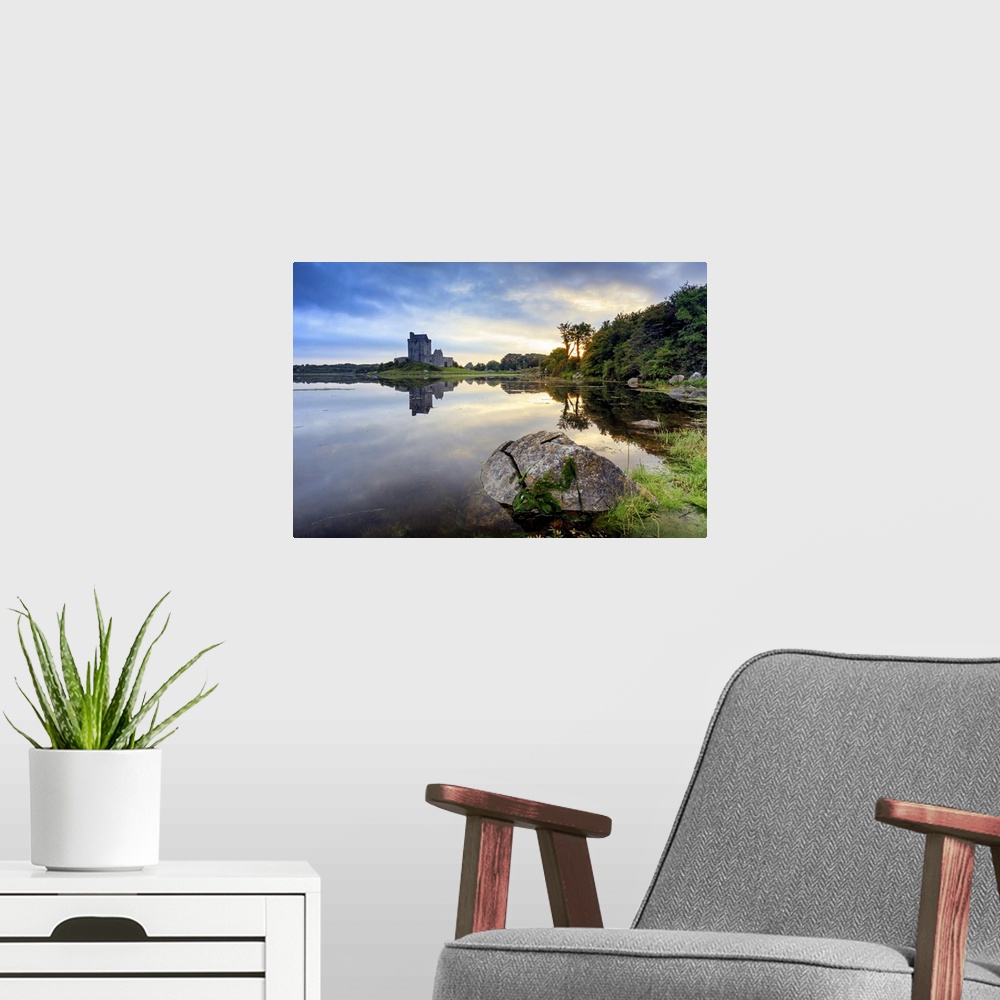 A modern room featuring Europe, Dublin, Ireland, Dunguaire castle in Kinvara village at sunrise reflecting in the ocean