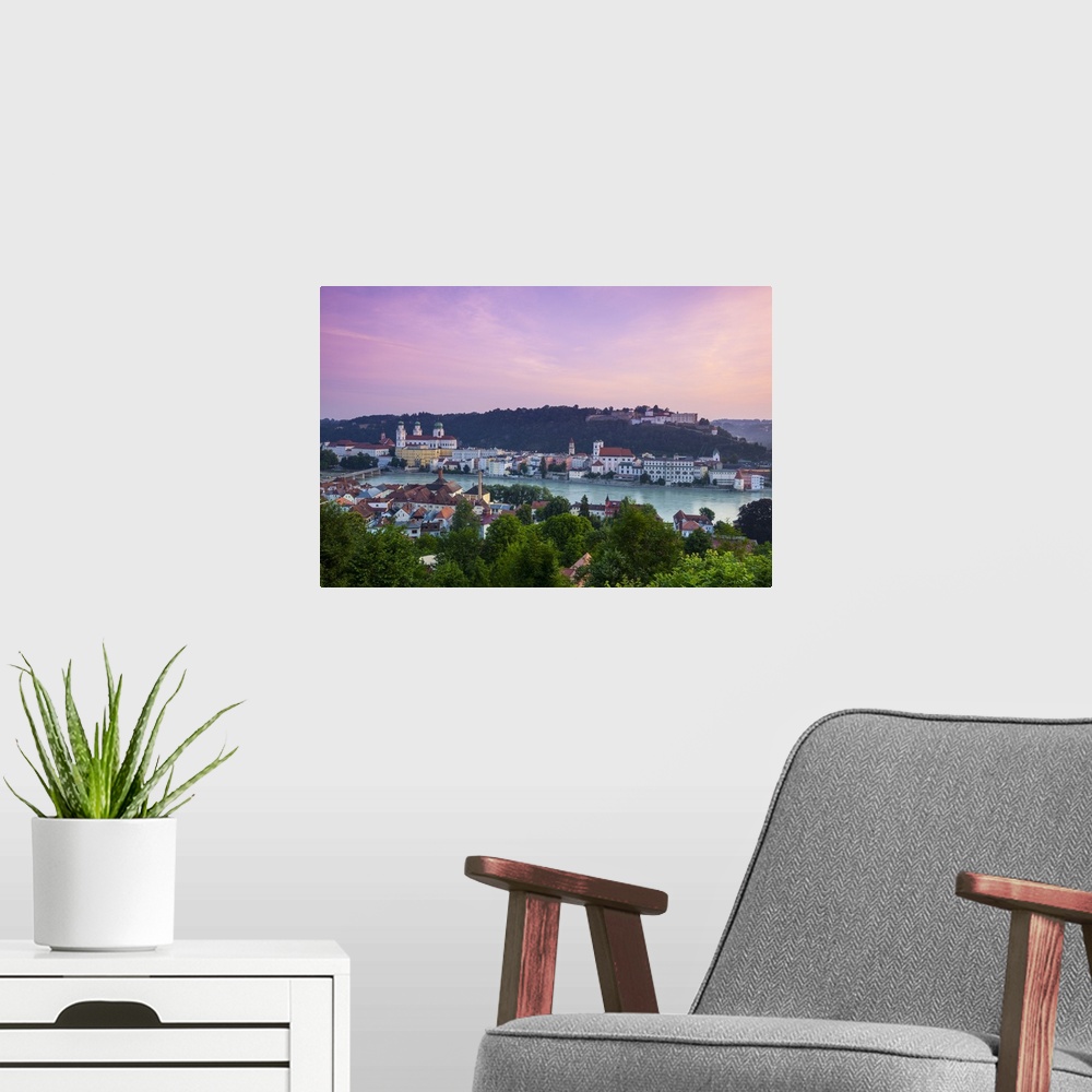 A modern room featuring Elevated view over Old Town Passau and The River Danube illuminated at Dawn, Passau, Lower Bavari...