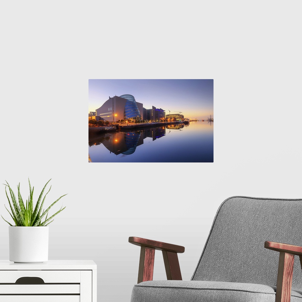A modern room featuring Europe, Dublin, Ireland, buildings reflecting on the Liffey river by night