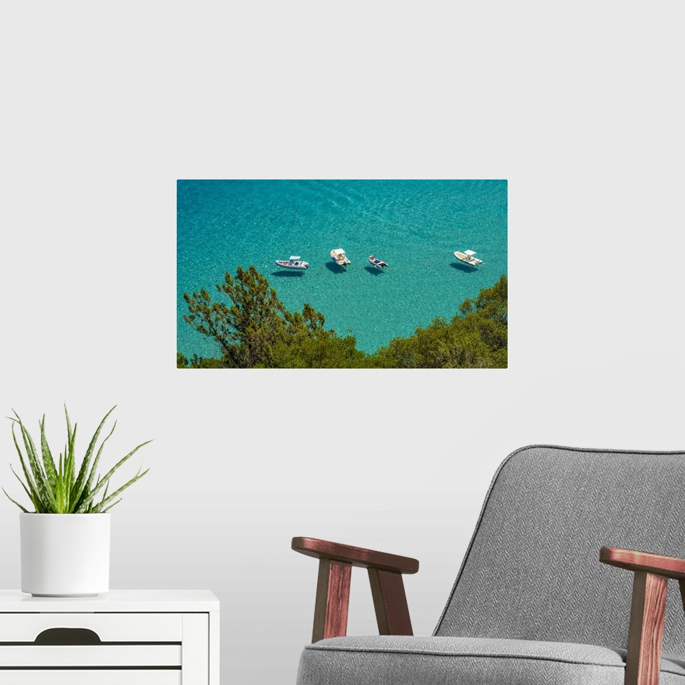 A modern room featuring Europe, Italy, Sardinia. View of the boats in Cala Luna.
