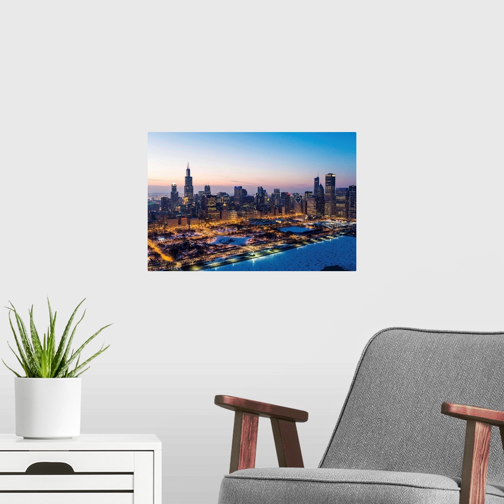 A modern room featuring USA, Illinois, Chicago. Aerial dusk view of the city and Millennium Park in winter.