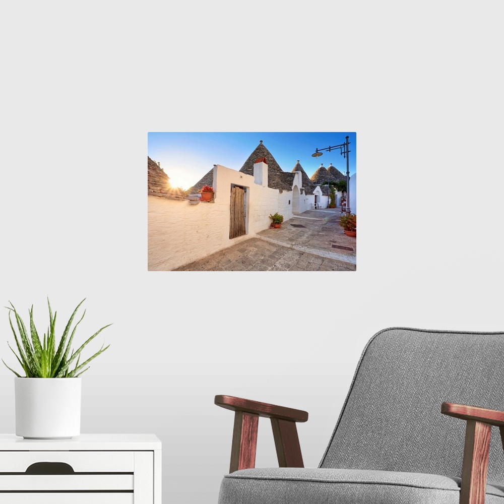 A modern room featuring Italy, Apulia, Bari district, Itria Valley. Alberobello. Trulli (typical houses)