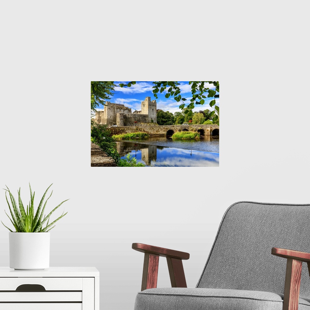 A modern room featuring Europe, Ireland, Caher, Tipperary, medieval town of Caher with fortress and bridge reflecting in ...