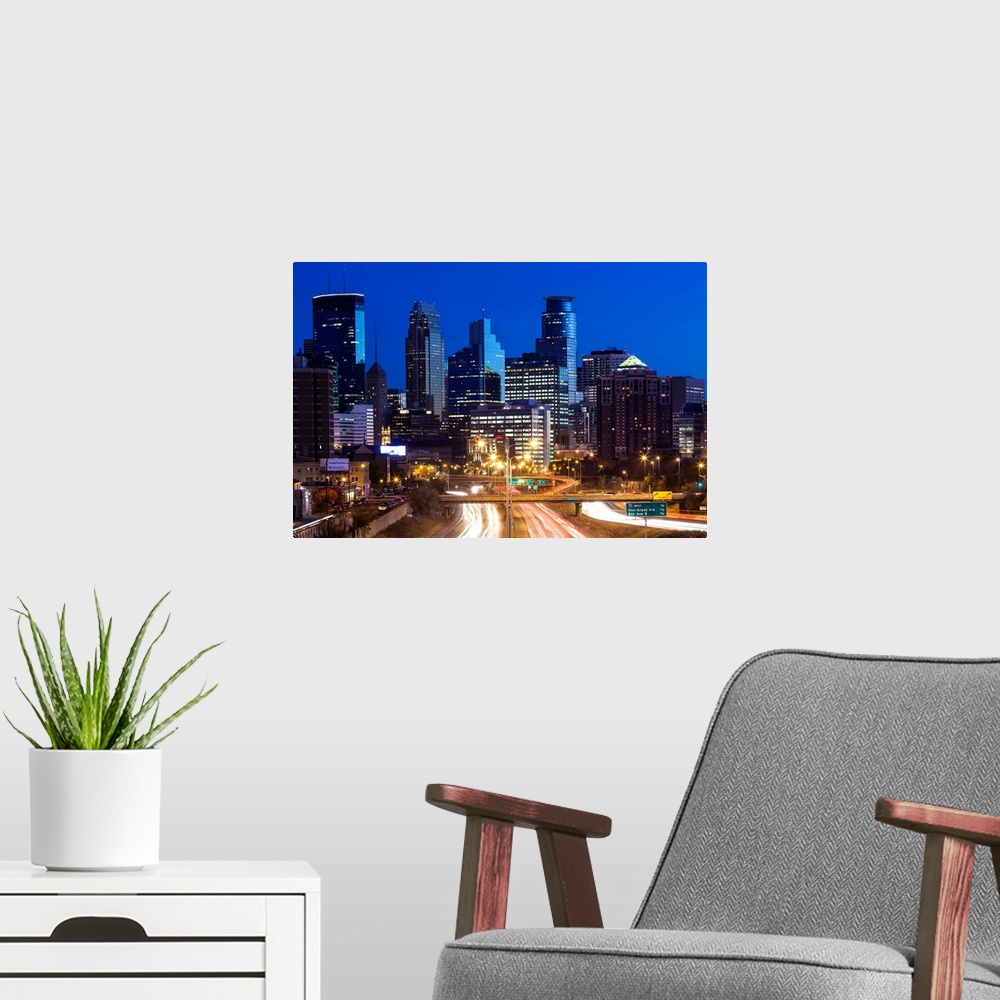 A modern room featuring USA, Minnesota, Minneapolis, city skyline from interstate highway I-35W, dawn