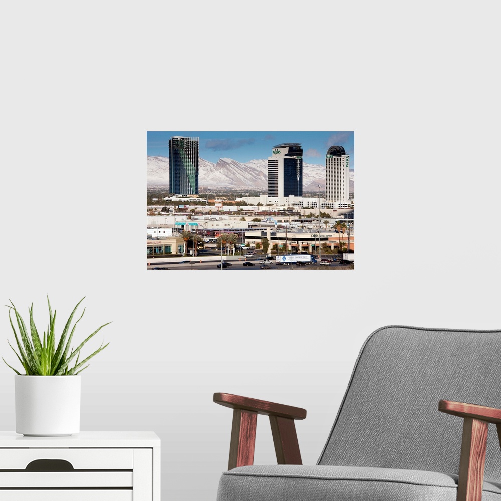 A modern room featuring USA, Nevada, Las Vegas, view west of Interstate 15 showing snow on mountains, morning