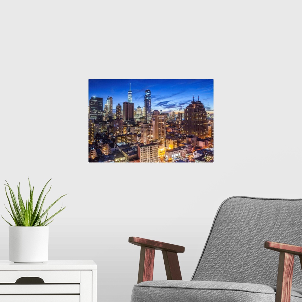 A modern room featuring USA, New York, New York City, Lower Manhattan, elevated view of SoHo, dusk